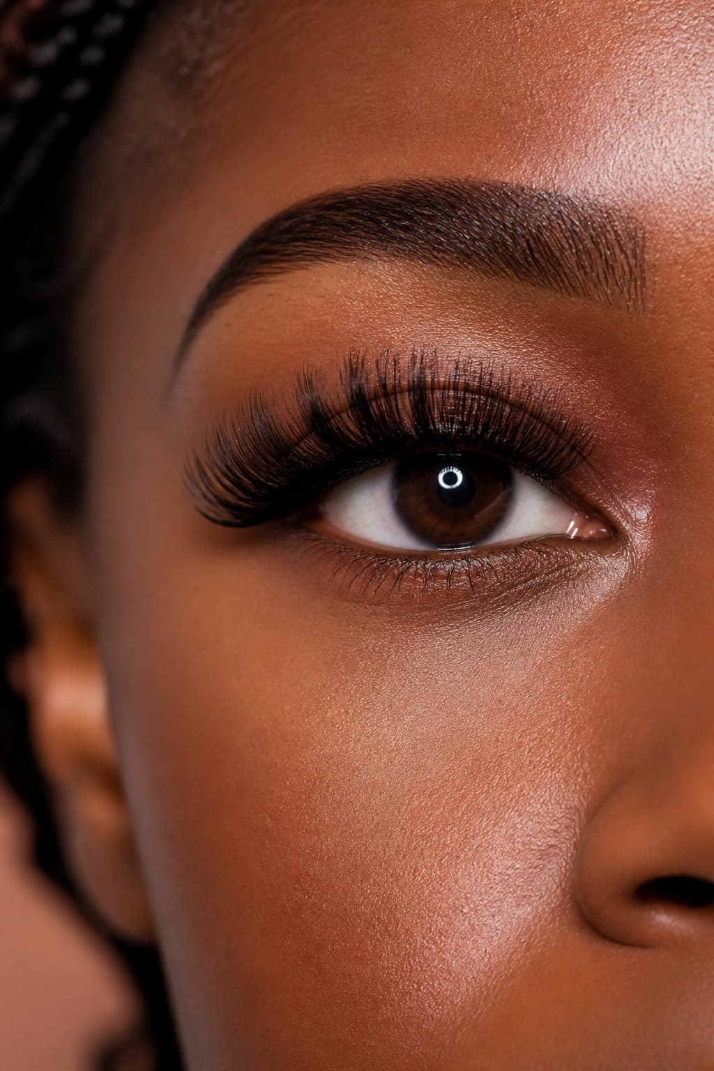 Close-up of volume eyelash extensions on a Black woman